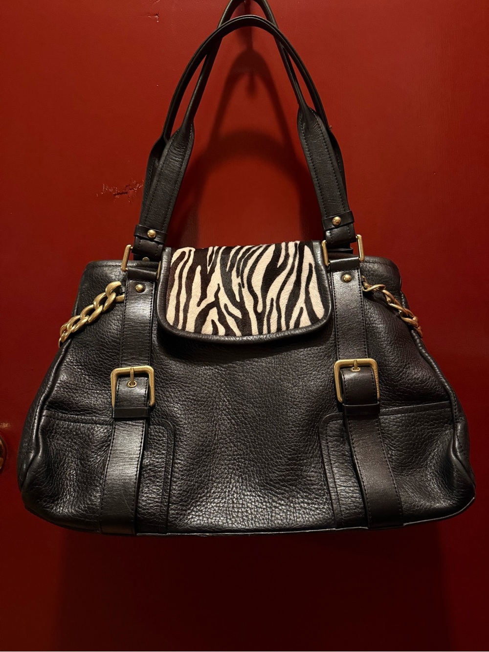 Kenneth Cole New York Black Shoulder Bag with Zebra-Print Flap and Gold Accents